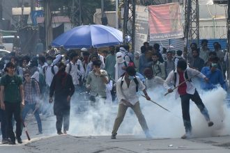 Police fire tear gas to disperse students protesting over an alleged on-campus rape in Punjab, in Rawalpindi, Pakistan, on October 17, 2024.