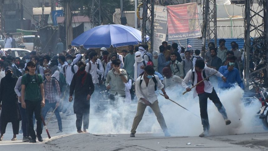 Police fire tear gas to disperse students protesting over an alleged on-campus rape in Punjab, in Rawalpindi, Pakistan, on October 17, 2024.