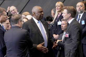 United States Secretary of Defense Lloyd Austin, center, speaks with Netherland's Defense Minister Ruben Brekelmans, third right, and Sweden's Defense Minister Pal Jonson, fourth right, during a meeting of the North Atlantic Council in NATO defense ministers format at NATO headquarters in Brussels, Friday, Oct. 18, 2024. (AP Photo/Virginia Mayo)