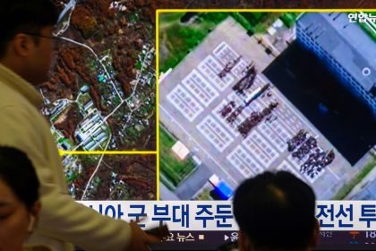 A TV at Yongsan Railway Station in Seoul shows a satellite image of Russia's Ussuriysk military facility, where South Korea’s National Intelligence Service (NIS) reported North Korean personnel gathering, on October 19, 2024.