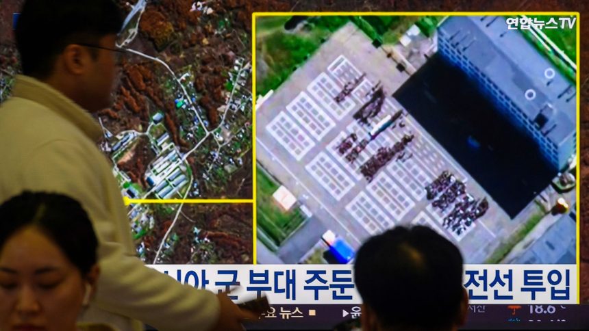 A TV at Yongsan Railway Station in Seoul shows a satellite image of Russia's Ussuriysk military facility, where South Korea’s National Intelligence Service (NIS) reported North Korean personnel gathering, on October 19, 2024.