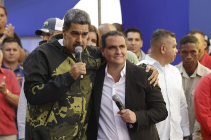 Venezuela's President Nicolas Maduro and Alex Saab stand in an embrace during an event marking the anniversary of the 1958 coup that overthrew dictator Marcos Perez Jimenez, in Caracas, Venezuela, Jan. 23, 2024.