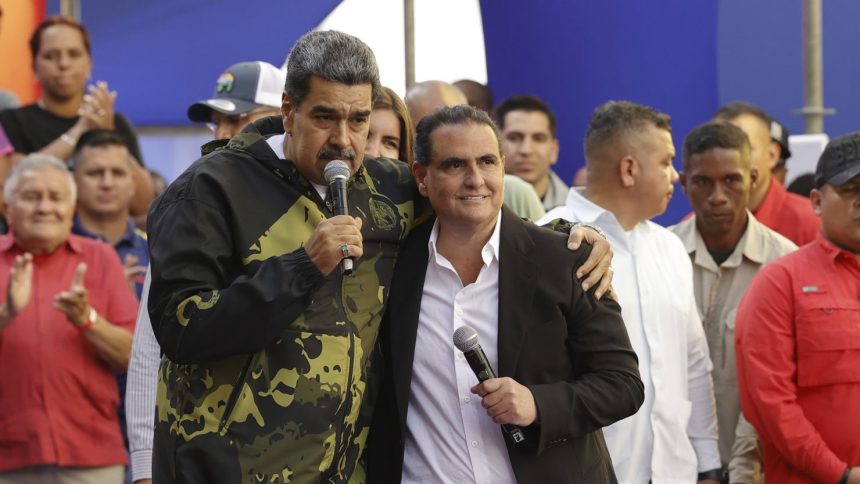 Venezuela's President Nicolas Maduro and Alex Saab stand in an embrace during an event marking the anniversary of the 1958 coup that overthrew dictator Marcos Perez Jimenez, in Caracas, Venezuela, Jan. 23, 2024.