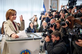 President Maia Sandu casts her vote in Chisinau during Moldova's presidential election and EU referendum on Sunday.