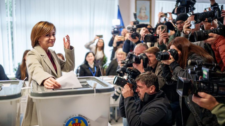 President Maia Sandu casts her vote in Chisinau during Moldova's presidential election and EU referendum on Sunday.