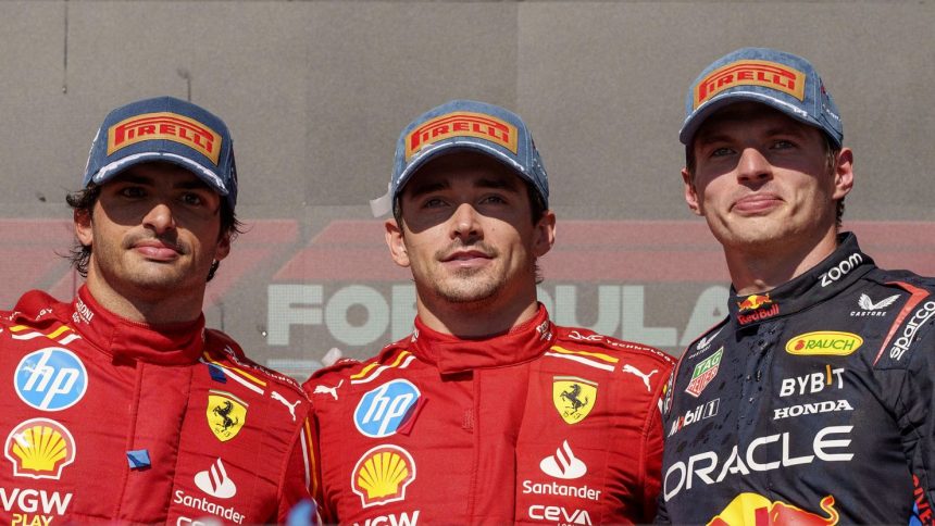 Ferrari driver Carlos Sainz (left) stands with race winner and teammate Charles Leclerc (middle) and Red Bull driver Max Verstappen (right), who placed third in the US Grand Prix.