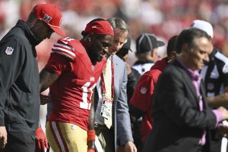 49ers receiver Brandon Aiyuk leaves the field after suffering an injury against the Kansas City Chiefs.