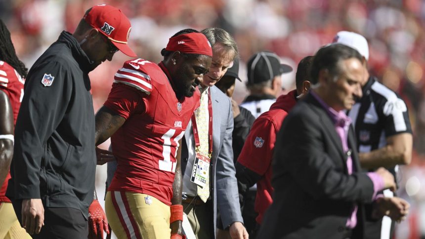 49ers receiver Brandon Aiyuk leaves the field after suffering an injury against the Kansas City Chiefs.