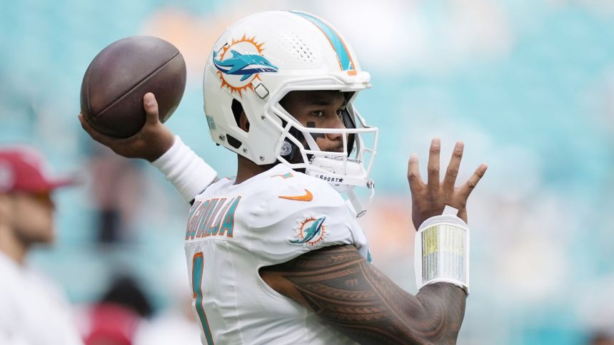 Miami Dolphins quarterback Tua Tagovailoa (1) warms up before an NFL football game against the Arizona Cardinals, Sunday, Oct. 27, 2024, in Miami Gardens, Fla. (AP Photo/Rebecca Blackwell)