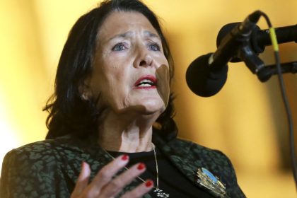 Georgian President Salome Zourabichvili speaks to a crowd during an opposition protest against the results of the parliamentary election in Tbilisi, Georgia, Monday, Oct. 28, 2024.