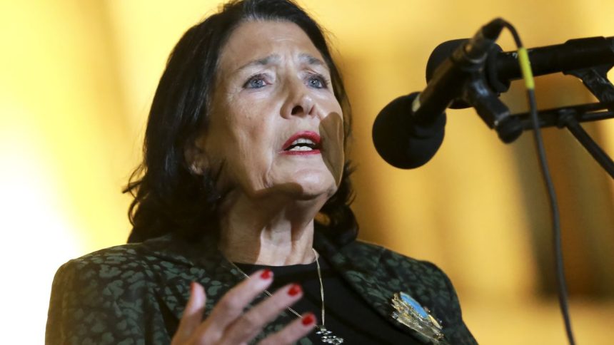 Georgian President Salome Zourabichvili speaks to a crowd during an opposition protest against the results of the parliamentary election in Tbilisi, Georgia, Monday, Oct. 28, 2024.