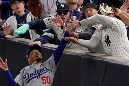 Two New York Yankees fans were ejected from Game 4 of the World Series after ripping the ball from Los Angeles Dodgers star Mookie Betts’ glove.