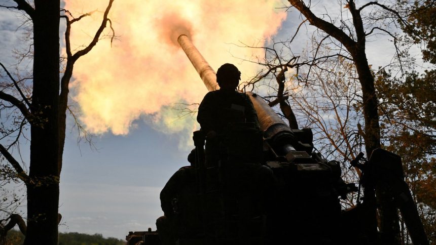 Ukrainian servicemen fire a self-propelled cannon towards Russian positions at a front line in the Donetsk region on September 27.