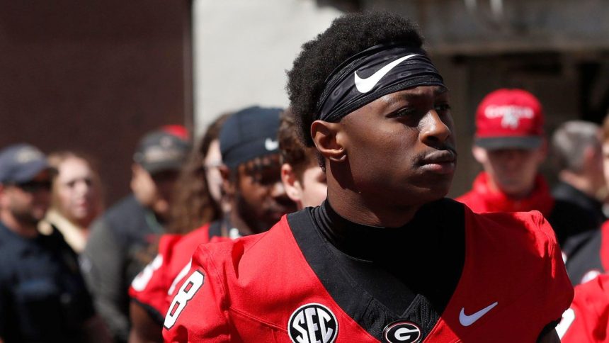 In this April 13 photo, Georgia wide receiver Colbie Young arrives with the team before the start of the G-Day spring football game in Athens, Georgia.