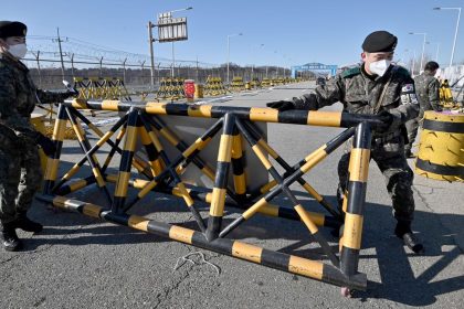 South Korean soldiers set a barricade at a checkpoint on the Tongil bridge, near the Demilitarized Zone (DMZ) dividing the two Koreas in Paju on December 15, 2020.