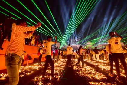 People in the Indian city of Ayodhya watch a laser show on the eve of Diwali in 2021.