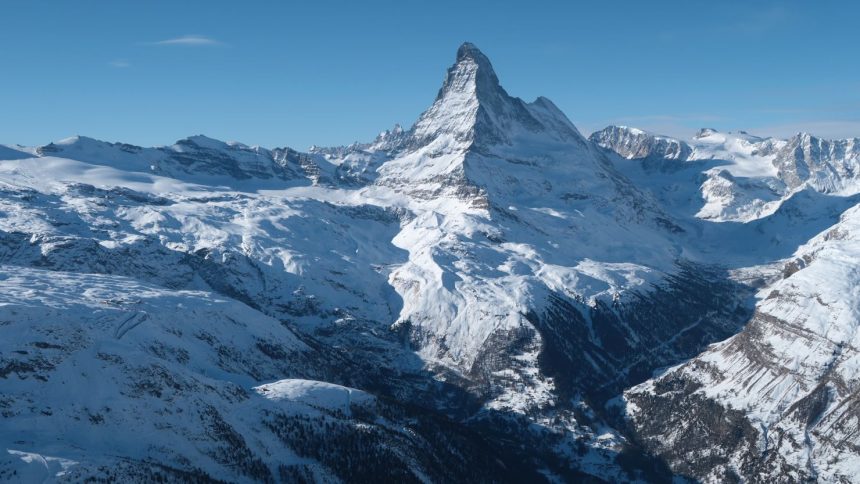 The Matterhorn mountain looms above the valley that includes the village of Zermatt on January 7, 2022 near Zermatt, Switzerland.