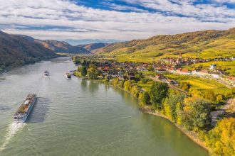 Ships make their way along the Danube River near Weissenkirchen in Austria. European river cruises are a great value right after Thanksgiving into the first two weeks of December, one travel expert says.