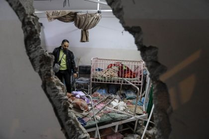 People inspect the damage caused by an artillery shell that hit the maternity hospital inside the Nasser Medical Complex, in Khan Younis, Gaza on December 17.