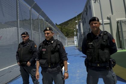 Italian police officers stand guard inside a recently build Italian-run migrant centre at the port of Shengjin, some 60 kilometers northwest of Tirana, on June 5, 2024.