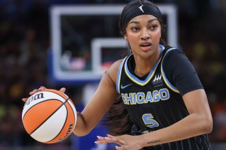 Chicago Sky star rookie Angel Reese brings the ball up court during the game against the Indiana Fever at Wintrust Arena on August 30 in Chicago.