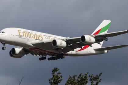 Emirates Airbus A380 double decker passenger aircraft spotted flying in the air between the blue sky and the clouds, on final approach for landing on the runway of London Heathrow Airport LHR in the United Kingdom. The superjumbo wide body airplane has the registration tail number A6-EUI and is powered by 4x Engine Alliance EA GP7270 jet engines. The long haul airliner is arriving from Dubai. Emirates EK is one of the flag carrier airline in the United Arab Emirates UAE owned by the Government of Dubai Investment Corporation of Dubai. The airline is the 4th largest in the world with main hub Dubai International Airport DXB, with a fleet of 249 planes. London, UK on September 2024 (Photo by Nicolas Economou/NurPhoto via Getty Images)