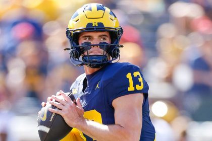 Michigan Wolverines Jack Tuttle warms up prior to a game at Michigan Stadium in Ann Arbor.