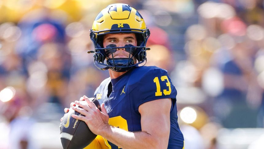 Michigan Wolverines Jack Tuttle warms up prior to a game at Michigan Stadium in Ann Arbor.