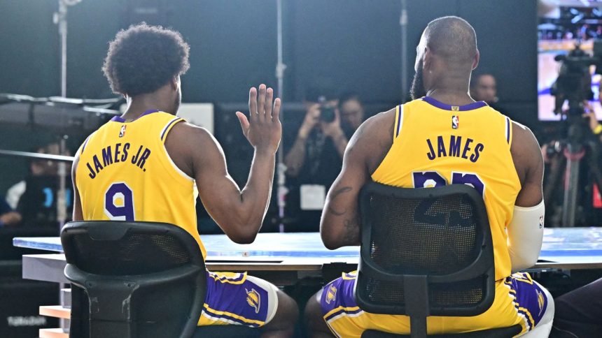 New Los Angeles Lakers guard Bronny James (No. 9) sits next to his dad LeBron James at the Lakers media day at UCLA Health Training Center in El Segundo, California.