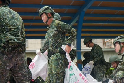 Taiwanese military personnel load sand bags onto a truck at a city government district office for distribution in anticipation of typhoon Krathon as it approaches Kaohsiung, Taiwan on October 1, 2024.