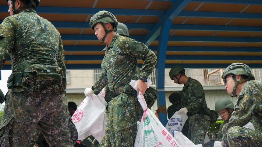 Taiwanese military personnel load sand bags onto a truck at a city government district office for distribution in anticipation of typhoon Krathon as it approaches Kaohsiung, Taiwan on October 1, 2024.