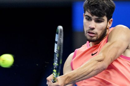 Spain's Carlos Alcaraz hits a return to Italy's Jannik Sinner during their men's singles final match at the China Open tennis tournament in Beijing on October 2, 2024. (Photo by Greg Baker / AFP) (Photo by GREG BAKER/AFP via Getty Images)