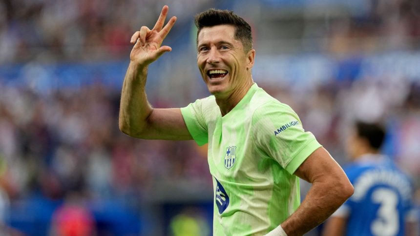 Lewandowski celebrates after scoring a hat-trick for Barcelona.