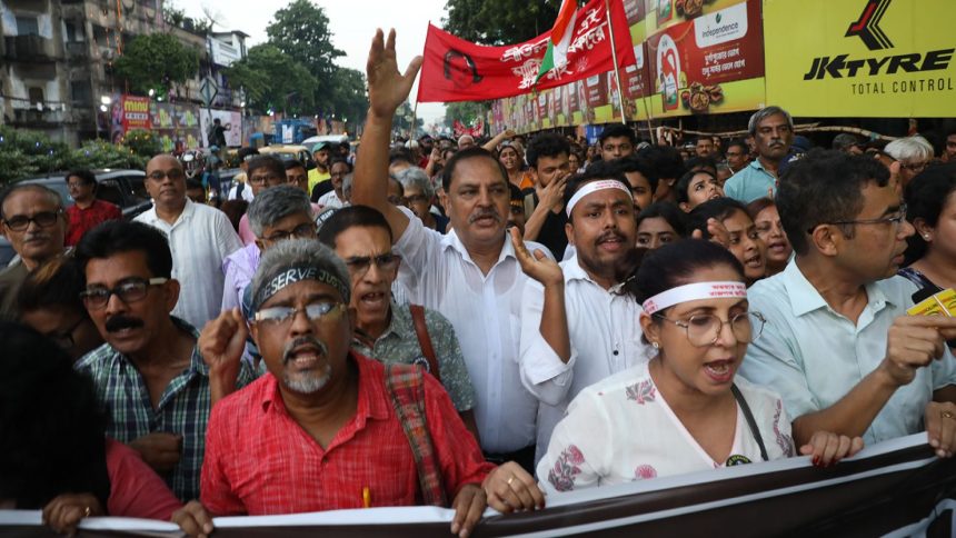 Doctors and citizens shout slogans during a protest march while junior doctors hold a hunger strike to protest against the rape and murder of a doctor trainee at RG Kar Medical College & Hospital in Kolkata, India, on October 8.