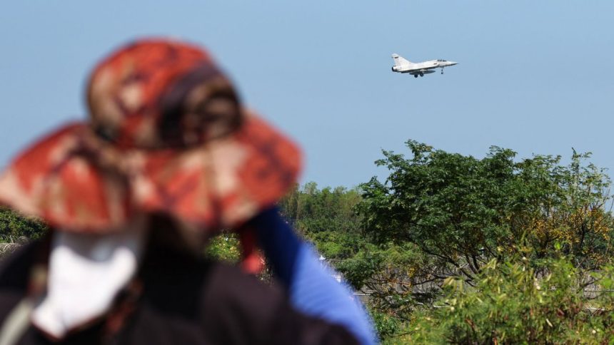 TOPSHOT - A Taiwanese Air Force Mirage 2000 fighter jet prepares to land at an air force base in Hsinchu on October 14, 2024. China deployed planes and ships to encircle Taiwan on October 14, in drills Beijing said were aimed at sending a "stern warning" to "separatist" forces on the self-ruled island. (Photo by I-Hwa CHENG / AFP) (Photo by I-HWA CHENG/AFP via Getty Images)