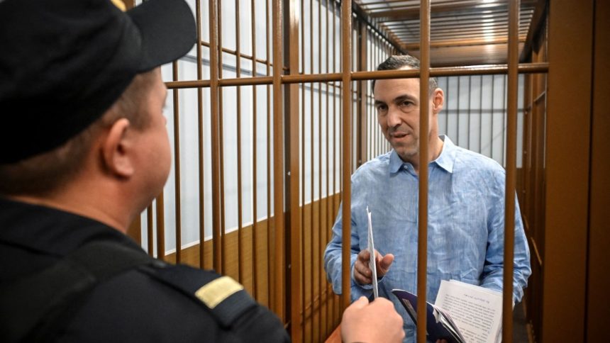 Laurent Vinatier, a French researcher accused of gathering Russian military information without registering as a "foreign agent", stands inside a defendants' cage during a hearing in Moscow's Zamoskvoretsky district court on October 14, 2024.