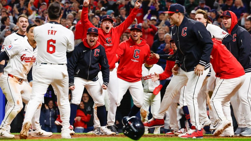 Cleveland Guardians celebrate a walk-off home run victory against the New York Yankees.