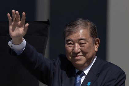 Shigeru Ishiba, Japan's prime minister, waves as he delivers a campaign speech in Osaka, Japan, on October 20, 2024.