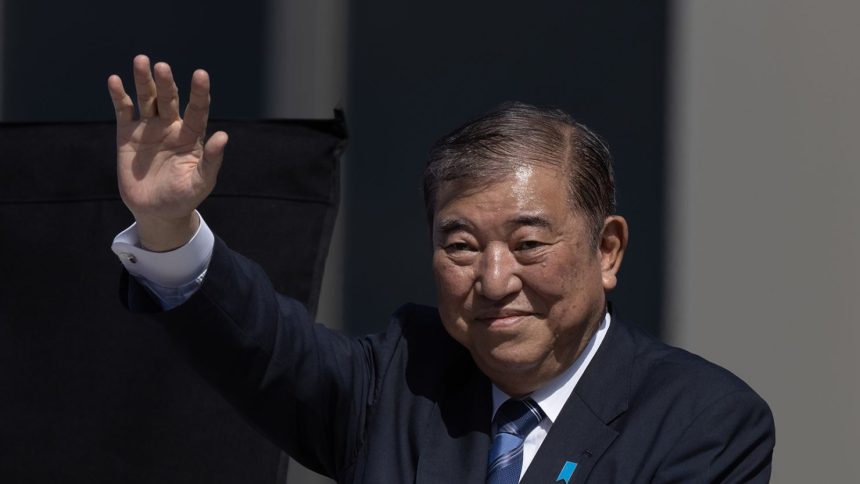 Shigeru Ishiba, Japan's prime minister, waves as he delivers a campaign speech in Osaka, Japan, on October 20, 2024.