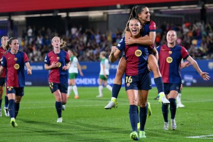 Fridolina Rolfö celebrates with teammate Kika Nazareth after scoring Barcelona's ninth goal from a penalty kick.