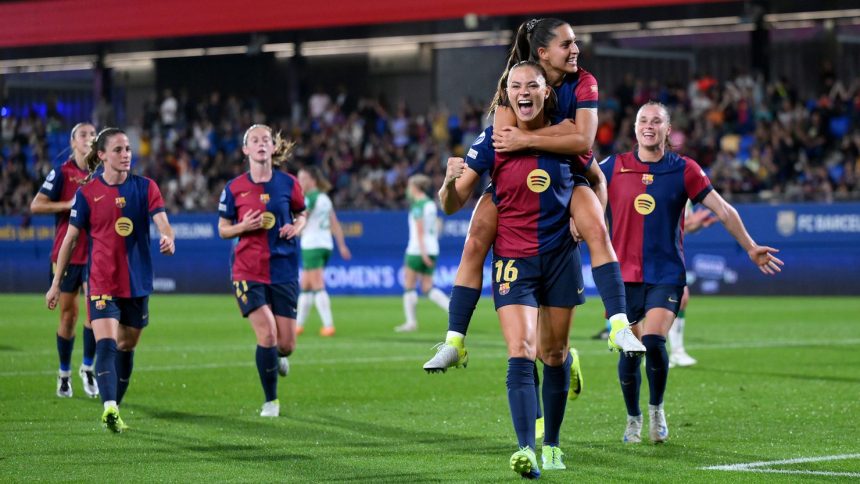 Fridolina Rolfö celebrates with teammate Kika Nazareth after scoring Barcelona's ninth goal from a penalty kick.