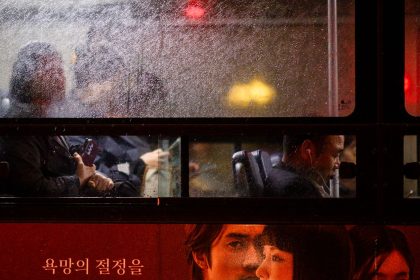 Commuters travel in a bus as it rains in Seoul, South Korea, on October 22, 2024.