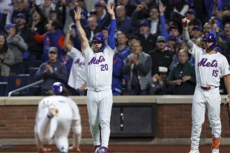 Pete Alonso and Tyrone Taylor celebrate as the New York Mets defeat the Los Angeles Dodgers 12-6 in Game 5 of the NLCS.