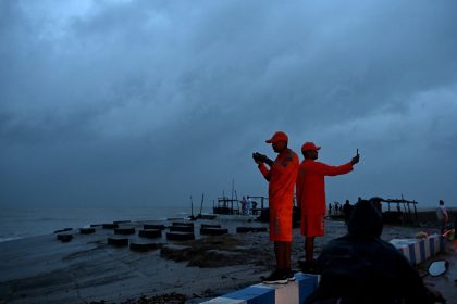 National Disaster Response Force personnel stand guard a beach near Digha, India on October 24, 2024, ahead of cyclone Dana's landfall.