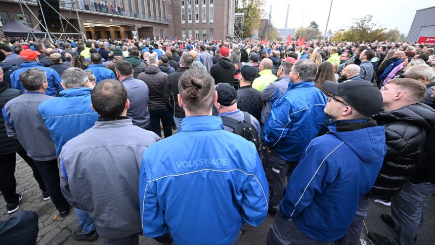 Volkswagen employees gather to hear from the automaker's works council at the company's headquarters in Wolfsburg, Germany on October 28, 2024.