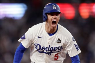 Freddie Freeman of the Los Angeles Dodgers celebrates after hitting a walk-off grand slam during the tenth inning against the New York Yankees during Game 1 of the 2024 World Series at Dodger Stadium in Los Angeles, California, on October 25, 2024.