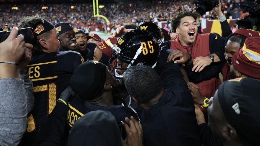 Washington Commanders players celebrate Noah Brown's game-winning Hail Mary touchdown catch to beat the Chicago Bears.