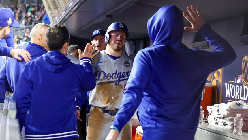 Dodgers players celebrate during Game 3 at Yankee Stadium.