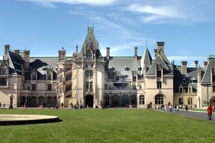 The 175,000-square-foot Biltmore House, photographed before Helene pummeled North Carolina, was largely unscathed by the storm. But other parts of Biltmore Estate had "significant flooding and damage to buildings," the Biltmore said.