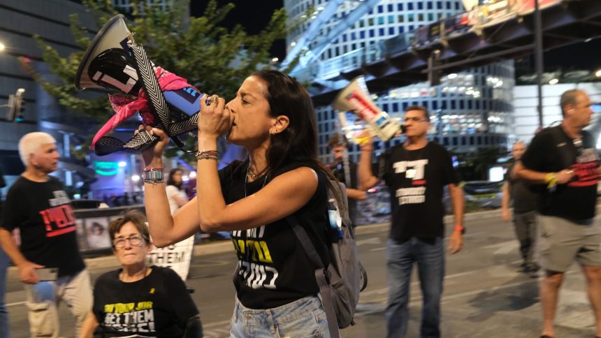 Demonstrators block a major thoroughfare in Tel Aviv on October 19, 2024, protesting against the government and demanding a ceasefire deal.